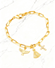 Pulseira Dourada Religiosa Nossa Senhora, Espírito Santo e Cruz Auvane em fundo de mármore claro com veios elegantes